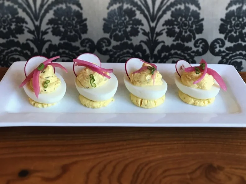 Attend any cocktail party in Mississippi, and there's bound to be a platter of deviled eggs â   likely somewhere between the cheese straws and the spiced pecans. In recent years, top restaurants have started putting their own spin on the bite-sized halves. The critically acclaimed Parlor Market in Jackson fills the hard-boiled divots with house-smoked catfish puree, then garnishes them with pickled onions and smoked comeback sauce, the house dressing of Mississippi. They are a big hit during happy hour to pair with adult slushies, creative cocktails and other classic Southern nibbles like pimento cheese and oysters Rockefeller.
