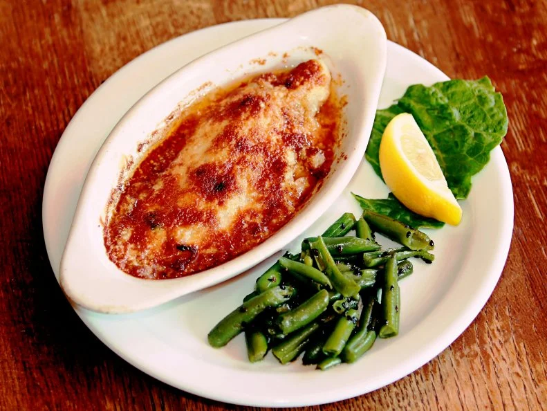 Frying is by far the most-popular way Mississippians cook catfish, but it’s by no means the only way. Since the 1980s, The Crown in Indianola has made a name for itself serving catfish “any way but fried.” The author of several cookbooks, including one devoted to catfish, proprietor Evelyn Roughton invites visitors to sample her luxurious-tasting award-winning smoked catfish pate before sitting down to a home-cooked lunch. The menu is ever-changing, but always features Catfish Allison, a cheesy baked casserole especially popular with women’s groups who come to The Crown weekly to dine, play bridge and catch up on the latest gossip. Blues travelers are often advised to plan a lunch visit to The Crown around a tour of the impressive B.B. King Museum and Interpretative Center a few blocks away.