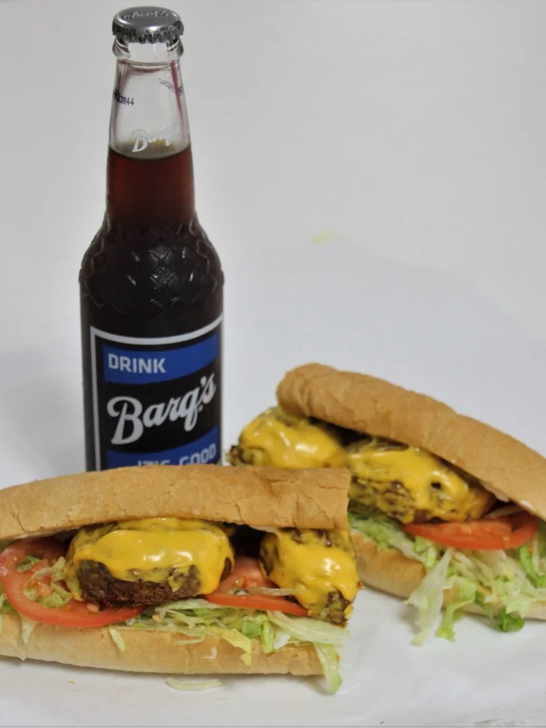 Of all the New Orleans creations to migrate across the Mississippi border, the po’ boy may be the most-prevalent, especially along the Gulf Coast. In the 1940s, a Biloxi restaurateur put his spin on this sandwich by toasting and pressing the bread on a grill after assembling the sandwich. When a customer from Vancleave asked for one with a fried crab patty and melted cheese, the combo now known by locals as the Vancleave Special was born. Though not necessarily mentioned by name, versions and adaptations can be found throughout the region, including at the The Po-Boy Express in Ocean Springs (theirs are toasted but not pressed). For a full Gulf Coast experience, wash it down with an ice-cold Barq’s Root Beer, the hometown soft drink of Biloxi, bottled there for a century.