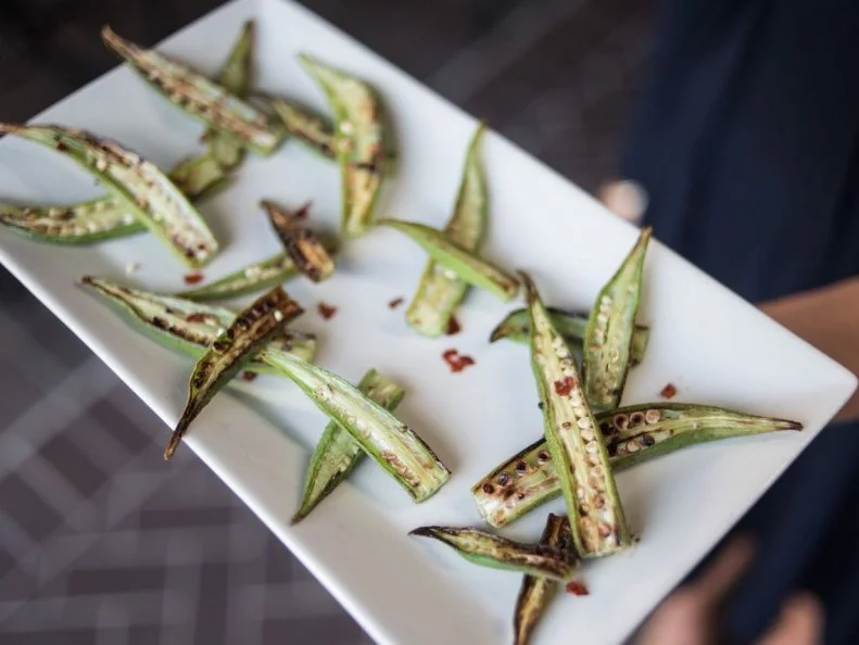 Okra is not for the faint of heart. With its fuzzy outside, slightly slimy interior and mild eggplant-ish taste, okra is either beloved or reviled. South Carolinians tend to love it, serving it fried or in stews for generations. It’s on many a menu, but the charred okra at Za’s on Devine in Columbia is changing the minds of naysayers by the droves. Split lengthwise, deeply charred on high heat and finished with a hint of sea salt and red pepper flakes, the light, shareable snack minimizes the slime and allows the flavor and texture of fresh okra to shine through. 