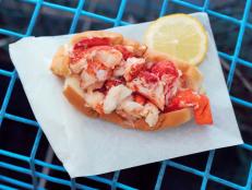 In warm months, many a Maine lobster roll loyalist makes the pilgrimage to the quaint shacks perched along the state’s rugged shoreline to devour that sweet, briny creation that perfectly encapsulates the essence of life by the sea. But when seasons or distance get in the way, several spots around the country let diners indulge in the regional delicacy far from the Pine Tree State. These Food Network-approved spots across the country stick close to the classic recipe: buttered split-top rolls slicked with mayo and stuffed with succulent lobster meat. Take a bite, close your eyes and let the fresh, bright flavors transport you; no boat necessary.