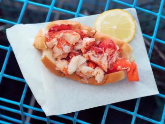 In warm months, many a Maine lobster roll loyalist makes the pilgrimage to the quaint shacks perched along the state’s rugged shoreline to devour that sweet, briny creation that perfectly encapsulates the essence of life by the sea. But when seasons or distance get in the way, several spots around the country let diners indulge in the regional delicacy far from the Pine Tree State. These Food Network-approved spots across the country stick close to the classic recipe: buttered split-top rolls slicked with mayo and stuffed with succulent lobster meat. Take a bite, close your eyes and let the fresh, bright flavors transport you; no boat necessary.