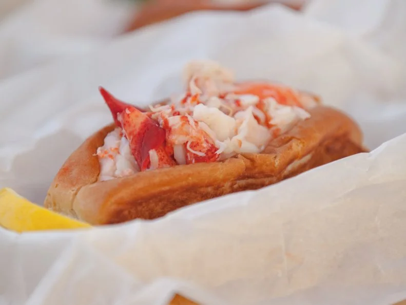 Cousins Jim Tselikis and Sabin Lomac successfully translated their Maine family tradition of backyard lobster bakes into a California-based food truck business in 2012. And a mainstay of their menu is the Maine lobster roll. Each sandwich starts with a split-top bun sourced straight from the Pine Tree State, which is then buttered, griddled and loaded with claw, knuckle and tail meat, Tselkis says. The toasty roll brings a beautiful balance to the mayo-accented mound of chilled Maine lobster meat stuffed inside. Lemon can be added according to one’s taste, as a freshly cut slice accompanies each order. Lobster lovers across the country continue to line up for the rolls, as the fleet has expanded into more than six other states and fueled enough demand for a brick-and-mortar spot in West Hollywood, California.