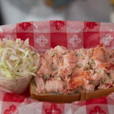 For more than 50 years, diners have flocked to this cheerful spot in the Hamptons that offers a seafood-centric menu and a beachy, throwback vibe… right down to the retro sign that earned this spot its nickname of Lunch among locals. Opt for the Classic Lobster Roll on the menu and you’ll get a toasted-on-the-outside bun spilling over with mounds of chilled claw and knuckle meat that co-owner Andrea Anthony describes as “very tender and sweet.” She tosses the succulent morsels of cold-water lobster with mayo and a bit of chopped celery for added texture, then piles them into the split-top roll that’s toasty on the outside and soft on the inside. “We’re all about quality and simplicity,” says Anthony, who also offers a gluten-free version of this menu mainstay. 