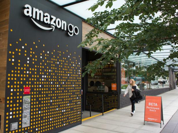 SEATTLE, WA - JUNE 16: A woman walks past the Amazon Go grocery store at the Amazon corporate headquarters on June 16, 2017 in Seattle, Washington. Amazon announced that it will buy Whole Foods Market, Inc. for over $13 billion.  (Photo by David Ryder/Getty Images)