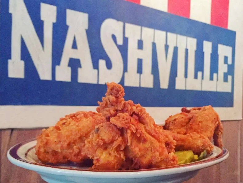 This Nashville-inspired bar is beloved for its craft beers, country music and sidewalk seating. Southern fare includes fried pickles, barbecue and a meat-and-three lunch. The buttermilk fried chicken is available Nashville Hot, using a wet rub of cayenne pepper and spices mixed with fat and stored hot. The chicken is fried to order, then dipped into the hot, spicy vats for a fiery coating. This Nashville heat can be added to tenders, wings, a leg-thigh-breast combo and a fried chicken sandwich, which is served with chips and a side of slaw to help soothe burning tongues.