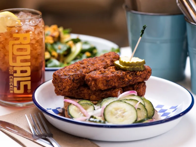 A short drive from Nashville, Royals in Louisville has mastered hot chicken. All chicken brines in a spicy, acidic mix for 24 hours. It’s then dried and double-floured to form a thick, crisp coating. Out of the fryer, the birds are dunked into spices and hot oil for a full fire immersion. Heat levels start at Mild, then creep up to Medium through Hot, X-Hot and Gonzo, and can be added to chicken and Southern-fried tofu. “Currently Medium is just barely edging out Hot as our most-popular heat level, but Hot is definitely trending towards becoming the most popular heat level as our customers get more adventurous,” says chef and owner Ryan Rogers. He estimates that only three percent of diners go for Gonzo. “We’re frequently told that the Gonzo is the hottest thing most people have ever had,” he says. “It contains a sizable amount of the three hottest chile peppers in the world, amongst a few other ‘tamer’-by-comparison spices.” Rogers recommends cooling off with the house milkshakes and soft serve, though he abstains. “Personally I love the burn, so I just wait it out.”