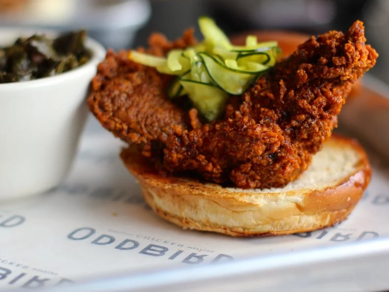 Extra coatings of a spicy paste up the heat index of chicken at this Atlanta restaurant. The paste is made with cayenne, smoked paprika, chile powder and jalapeño, according to co-owner Jennifer Johnson. Since spice perception varies based on the palate, Johnson’s team tried to create a universal rating on a scale from one to 10. “As we developed our Oddbird menu, we did our best to create an ‘objective’ rating,” she explains. “For our Hot to rate a six or seven, and our Too Hot to rate a nine or 10.” The restaurant serves its hot chicken in a biscuit or a sandwich, but the most-popular hot chicken is served over buttermilk waffles. Johnson recommends offsetting the burn with an IPA or a house boozy milkshake, such as the Cinnamon Toast Crunch Boozy Shake.