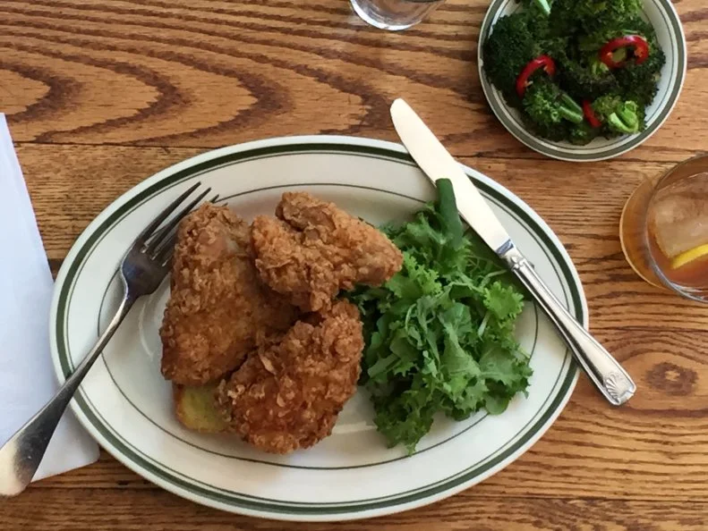 Peaches is a New York destination for hot chicken. The kitchen prepares three spice levels — Regular, Hot and Extra Hot — with about 20 percent of customers opting to go all-in on the burn. The chicken is brined overnight with hot peppers and spices. The birds are then seasoned to-order with additional Hot or Extra-Hot spice. In lieu of the typical fiery oil dunk, Peaches dry-rubs hot chiles onto the skin just before serving, to keep the texture crispy with a juicy interior. As for how to quell the fire, Co-owner Craig Samuel says “Our hot pepper rub is water soluble, so trying to abate the heat with water is futile. Bread helps,” he offers. “But honestly, if you ordered it Extra, you wanted it Extra, right?”