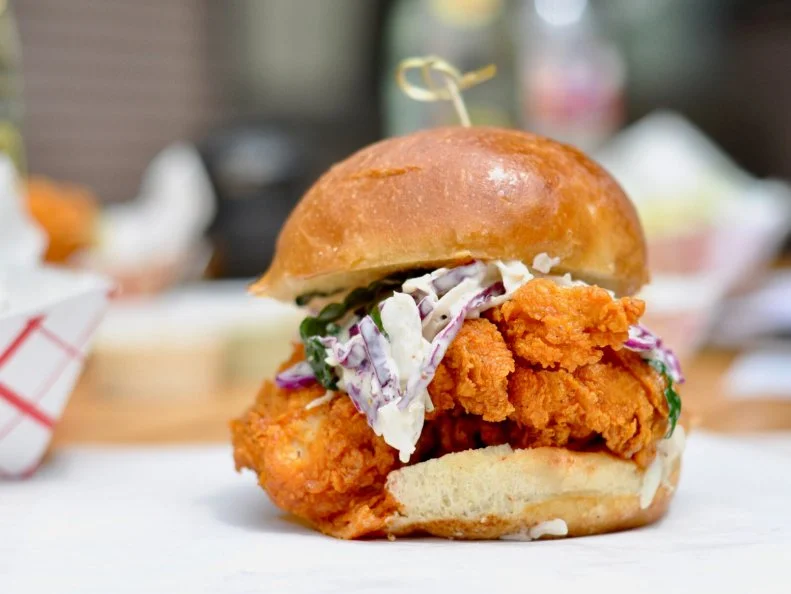 Fire in the Hole is the hilariously apt name for the spiciest chicken at this Austin trailer. Dreamed up by local chef Harold Marmulstein after he spent time in Nashville, the restaurant cooks chicken to order, coating the birds in a special secret blend of seasonings with a proprietary spice dip. The name comes from what happens next: To fully spice the chicken, it is tumbled 22 times in the mix, coating the crisp bird in a choice of four sauces, Wimpy, Hot, Dang Hot and Fire in the Hole. About a dozen people go all-out with the spiciest blend each day. Those who regret it can cool off with the house sauces, which include classic ranch, sweet chile yogurt, cilantro-mint and the remoulade-style Comeback Sauce. The most-popular order is the O.G. Classic Chicken Sandwich, which tops a fried chicken breast with kale slaw, pickles and mayonnaise.