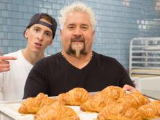 Hunter and Guy Fieri with a tray of croissants at La PanderÃ­a cafe in San Antonio, Texas, as seen on Diners, Drive-Ins, and Dives, Season 27.