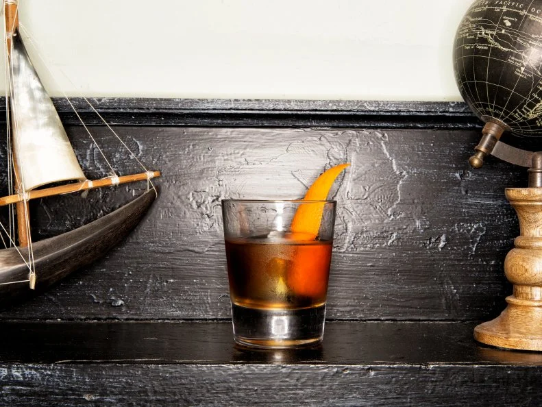 One of Nashville’s first serious cocktail bars, the Patterson House is still its best. The reservation-only policy means that there’s never a chaotic scene around the rectangular island bar at the center of the room. A library motif, antique chandeliers, and an army of well-dressed barmen are there to greet you, but don’t let the serious scene intimidate you — the staff is just as happy to pour a gin and housemade tonic as to mix a custom craft cocktail. The menu is organized by spirit, with drinks listed from least to most potent. There’s a small food menu, including mini burgers, truffled deviled eggs and roasted bar nuts. 