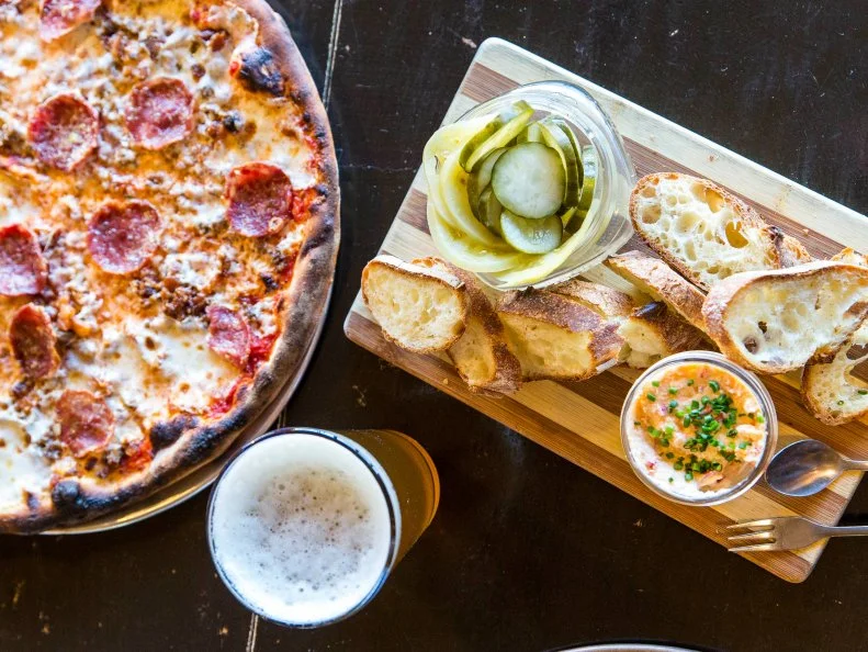 Located in North Charleston’s hip Park Circle neighborhood, EVO (Extra Virgin Oven) — along with its sister bakery out back — lures locals from miles around. —Creative starters like wood-fired olives, puffy focaccia bread and house-made pimento cheese and pickles pave the way for Neapolitan-style pizzas. The pistachio pesto pie features fromage blanc from Split Creek Farm; the Pork Trifecta is a meat lover’s bonanza of bacon, house-ground sausage and Felino salami, as well as their own house-pulled mozzarella.