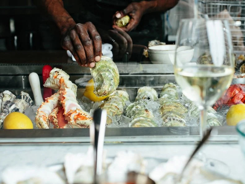 Of course, oysters can be found throughout the city, but there may be no better location for slurping some from near or far than The Darling Oyster Bar on now-booming Upper King Street. The U-shaped oyster bar — staffed by friendly shuckers with chops — seats just 14, but goes through more than 4,500 oysters weekly. The team sources the freshest oysters each day, with a focus on bright, briny East Coast options. Those in the know  head for Oyster Happy Hour every day from 4pm to 7pm, with select house oysters shucked for a dollar each to pair with drink specials.