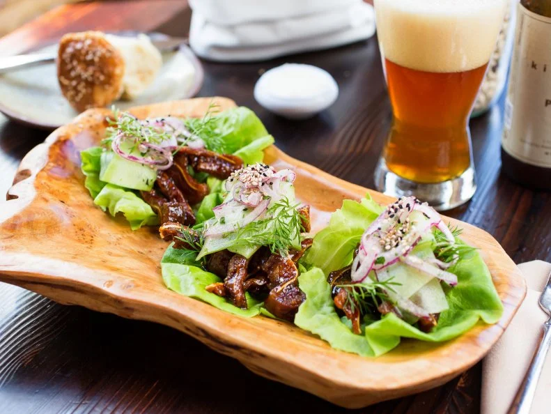 Perhaps no other restaurant — in Charleston or all of the South — has furthered the cause of Southern fare more than Husk. According to Chef-Partner Sean Brock, “If it doesn’t come from the South, it doesn’t come through that door.” The menu showcases local and regional ingredients, farmers, fishermen and other suppliers, with dishes like their glazed pig ear lettuce wraps. The menu changes twice a day, but dishes like the wraps, shrimp and grits, fried chicken and skillet cornbread with Benton’s bacon crumbles rarely leave the list. With a location in Nashville and more on the way in Greenville, South Carolina, and Savannah, Husk is sharing Southern bounty throughout the region.