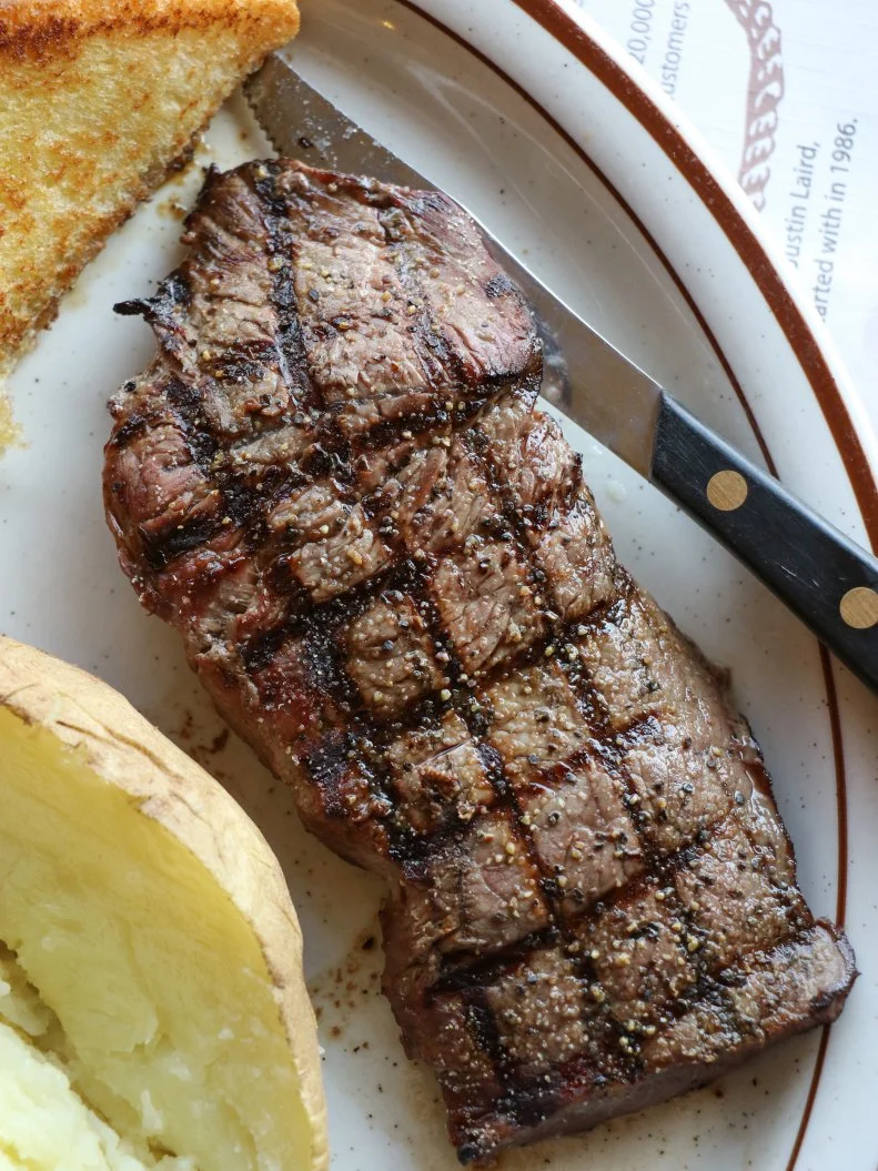 Cooking beef over indirect flames is one of the oldest South Dakota culinary traditions. Most South Dakota restaurants serve steak, but a trip to the capital city of Pierre will get you one of the best beef steaks in the Midwest. Cattleman’s Club Steakhouse serves only Black Canyon Angus Beef aged, trimmed and seasoned to their specifications in cuts of bone-in ribeye, T-bone, top sirloin, prime rib and porterhouse. Myril Arch founded the steakhouse in 1986 and his daughter Cindy runs it now. Myril couldn’t afford carpet so he put sawdust on the floor, which to this day, adds to the charm of the rustic steakhouse by the river. Get here early: Doors unlock at 5 p.m. and the parking lot is nearly full before that.