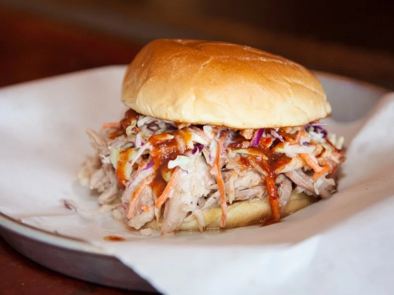 Few pitmasters carry the torch for whole-hog barbecue. But itâ  s a dying art that Pat Martin aims to uphold through his barbecue restaurants in Nashville and beyond. With customized pits in each of his joints, Martin smokes whole hogs every day, serving up tangles of the sweet, smoky meat and charred bits by the platter. The selection goes wider with wet and dry ribs, an addictively fatty brisket, spicy sausage and smoked turkey, plus an array of the pitmasterâ  s homemade sides, like broccoli salad and baked beans. At the Downtown location, youâ  ll also find a sprawling, landscaped beer garden.
