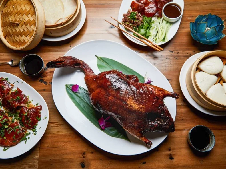 TÃ nsuÇ  is pushing Nashvilleâ  s international culinary options into new territory. A partnership between New York dumpling chef Chris Cheung and Chopped judge Maneet Chauhan, the upscale, contemporary Chinese restaurant is housed in a large, dimly lit room accented with mod paper lanterns. Serving lunch, dinner and brunch, the menus offer riffs on traditional Chinese and Chinese-American classics, like beef chow fun and open-face pork dumplings. The dim sum brunch is a standout: The selections arrive on a cart from which you can pull small plates of star-shaped lobster dumplings, pork belly bao buns and mapo tofu.