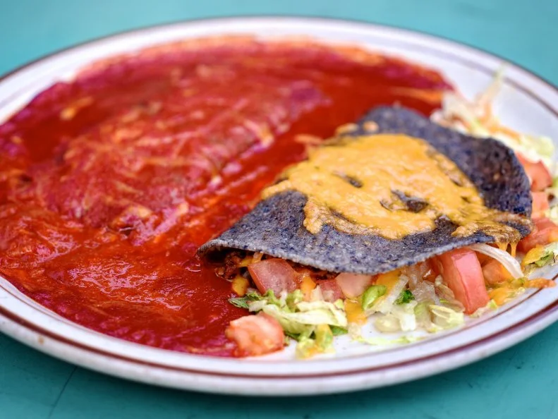 The Shed is a Santa Fe dining institution. Follow the colorful sign announcing “creative cookery” — just east of Santa Fe’s historic plaza — into a bustling, bright hub happy diners and great food. The menu offers a combination of New Mexican food (green chile stew and the carne adovada plate) and American fare (the Shedburger, for example, topped with pico de gallo). The Shed is best known for red chile enchiladas — or really, any dish with red chile on top. Those craving “Shed red” can purchase jars of it to enjoy at home.