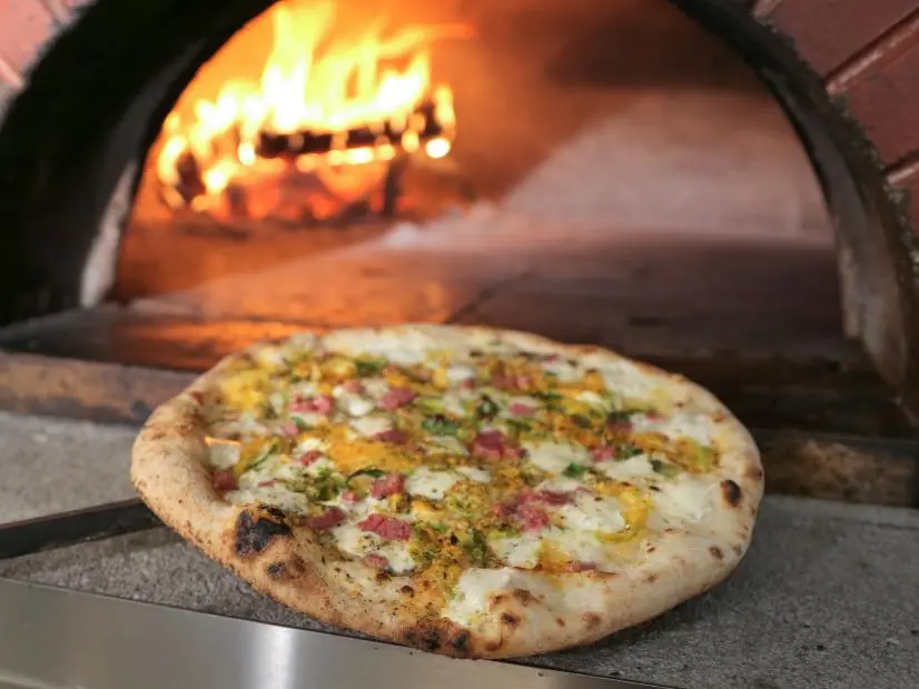 The Belgio Dulce Pizza Fresh Out of the Oven as served at Fat Olives in Flagstaff, Arizona as seen on Food Network's Diners, Drive-Ins and Dives episode 2706.