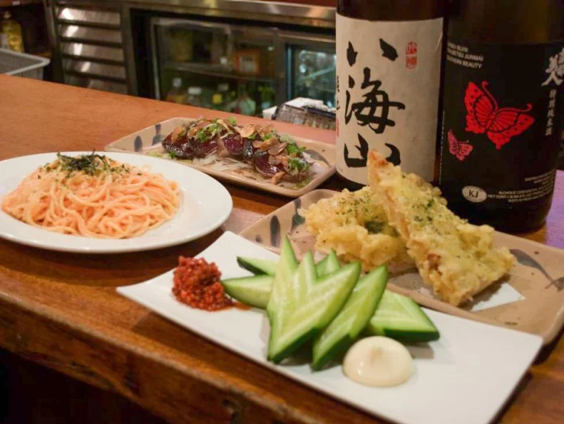 This Times Square institution is hailed for its cool Japanese pub vibe and incredible sake selection. You don't have to be an aficionado of rice wine to enjoy the place, though: It's also known for its excellent bar bites (and inexpensive beer). The most-iconic dish on its menu — and the one most representative of NYC — is the deep-fried slice. For each order, a slice of of plain cheese pizza (of unknown origins) is dipped in tempura batter and lobbed into a vat of hot oil. Although it sounds like it would feel like a brick in the gut, it's not. These battered slices are actually light, crisp and devoid of excess grease.