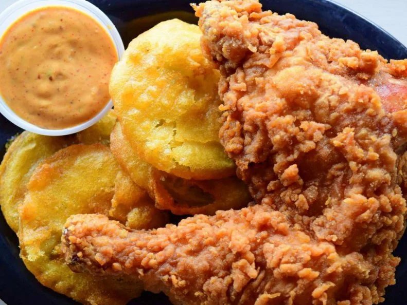 Fried green tomatoes are a mainstay throughout the South. The version sold at Irondale, Alabamaâ  s Irondale cafÃ©, though, is responsible for pushing the traditional dish into the national limelight â   and the Hollywood spotlight. Since the release of Fried Green Tomatoes, the 1991 film based on Fannie Flaggâ  s book, the crisp, salty, tart slices of fruit jumped out of the Southâ  s frying pan and into the national fire. And the restaurant that inspired the heartfelt movie became the preeminent fried green tomato destination, selling 600 to 800 slices a week to hungry tourists looking for a slice of female empowerment. Available as a side dish or main course, the rounds are served with a creamy and spicy remoulade.