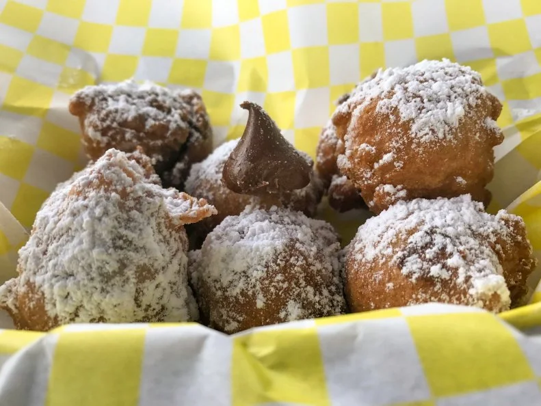 Fried Oreos, fried funnel cake balls, fried lemon balls, fried Snickers, fried Twinkies: Momâ  s Kozy Kitchen, a Hot Springs food truck, conjures a fairgroundâ  s fried smorgasbord of desserts without the fleeting timeline of a State Fair. The funnel cake chocolate balls are the blue ribbon winner. Funnel cake batter studded with a chocolate kiss in the center, each ball is tossed into a 350-degree fryer, then dipped in powdered sugar. Served warm, the ball releases a pool of melted chocolate that infuses the sweet and fluffy cake.