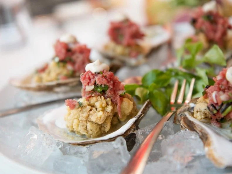 Fried oysters are a staple up and down the East Coast, from the top of Maine down to Key West. But in South Norwalk, Connecticut, Matchâ  s Chef-Owner Matt Storch has created an upscale variation that could be the state dish. Local bluepoint oysters are dredged in semolina batter, fried to a flaxen hue and set back in their shells. Served warm, each mollusk is topped with cool beef tartare and a touch of aioli.