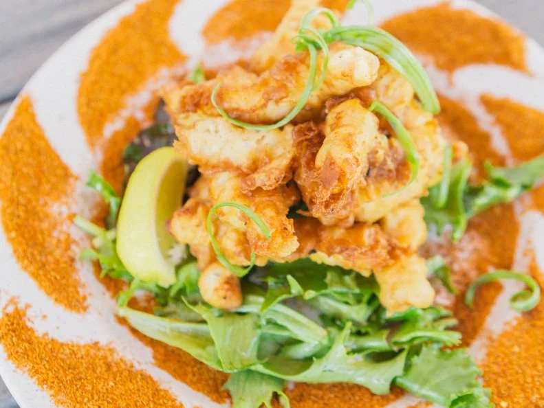 Alligator might sound exotic, but like so many other odd-sounding dishes, it really does taste a lot like chicken. And in some parts of Florida, it’s nearly as common. At Kush, a beer-centric, locavore restaurant in Miami’s artsy Wynwood neighborhood, Matt Kushner serves Florida Alligator bites that are an upscale, crab house-style twist on the Sunshine State classic. Fresh, local alligator from Cypress Creek Farms is coated in a light batter and fried until crisp. The resulting nuggets are seasoned with Old Bay and served with spicy mayonnaise.