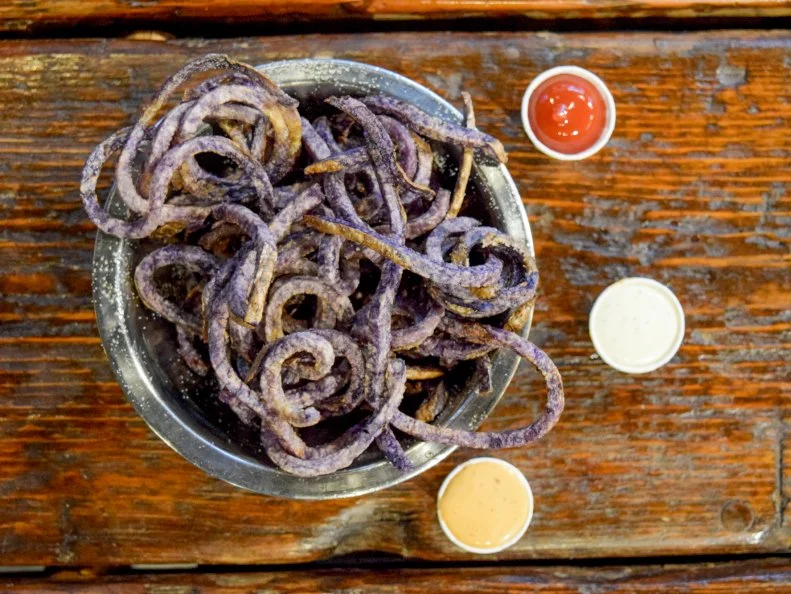Idaho’s potatoes are so world-famous, the state has its own potato museum. In the state capital, Boise Fry Company salutes the beloved spuds by dedicating an entire restaurant to fries. (O.K., it does serve burgers, too.) Sourced locally from M&M Heath Farms in nearby Buhl, Idaho, the fast-casual concept offer seven different varieties of potatoes -- Russet, Gold, Laura, Yam, Sweet, Purple and Okinawa -- chopped into choice of five different cuts. Whether you go for regular, curly, shoestring or whatever else, each order is deep fried to-order and served with a selection of housemade dipping sauces. Basically, this place is Choose Your Own Adventure of French fries, and it’s just as much fun as the vintage books.