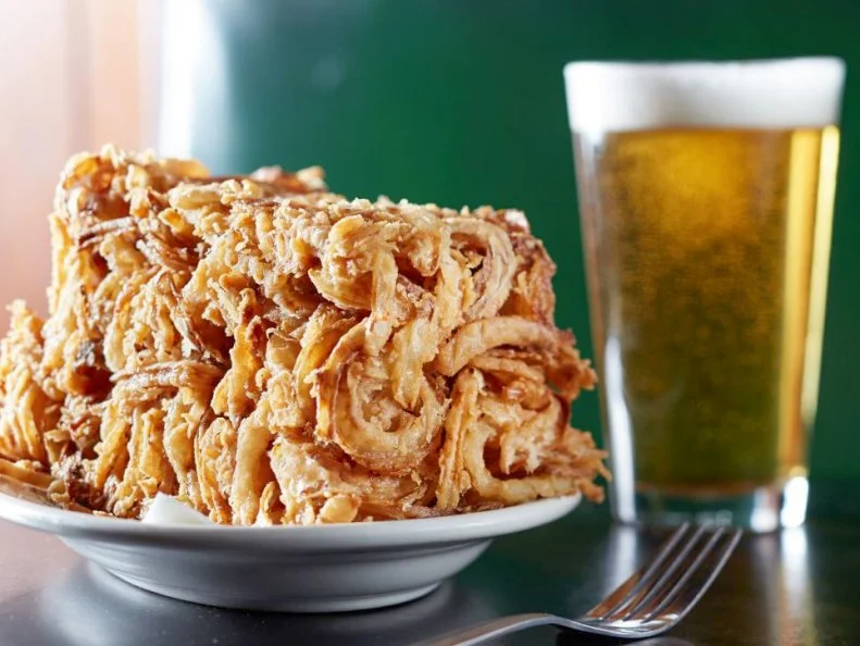 A golden mass of deep-fried snack food, Hackney's Original French Fried Onions are basically a pile of onion strings shaped into the form of a brick. Thinly sliced Spanish onions are coated in a bready batter, deep-fried to a rich amber hue and piled into a rectangular loaf that's become a local obsession, best enjoyed on the patio with a beer.
