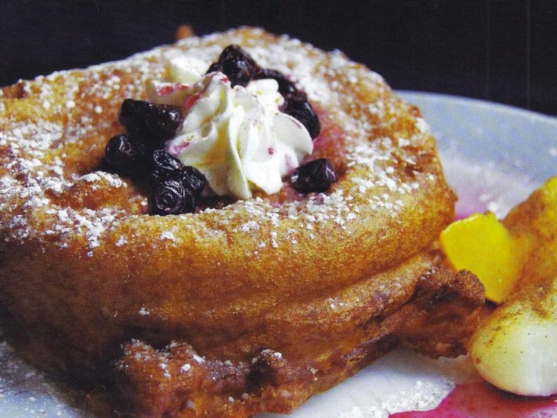 Set under the dramatic mountain peaks of Glacier National Park, this seasonal, family-owned cafe is a top destination for tourists and locals through the summer months. The views are stunning, the staff is friendly and the food has received national praise. The stuffed French toast is a top pick, filled with combinations like hazelnut-vanilla and caramel-apple. The most-beloved rendition, thatâ  s most-emblematic of Montana and certainly most-famous, is the huckleberry. French toast is stuffed with local huckleberries and cream cheese, dipped in batter and deep fried until crisp on the outside, gooey within. The whole thing is dusted with powdered sugar and crowned with more huckleberries and a dollop of whipped cream.