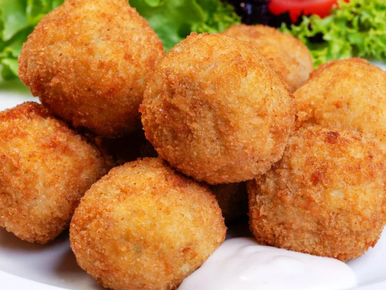 Maryland may earn name recognition for its crab cakes, but Delawareâ  s deep-fried crab balls are just as good, and perhaps the Mid-Atlanticâ  s best-kept secret. Seafood shacks throughout the region serve them. For more than 70 years, Medingâ  s, a Milford seafood haven, has served little puffs of deep-fried crab for the masses to plunge into tartar sauce. Made with no fillers, the well-seasoned crab rounds are salty, sweet and truly addictive.