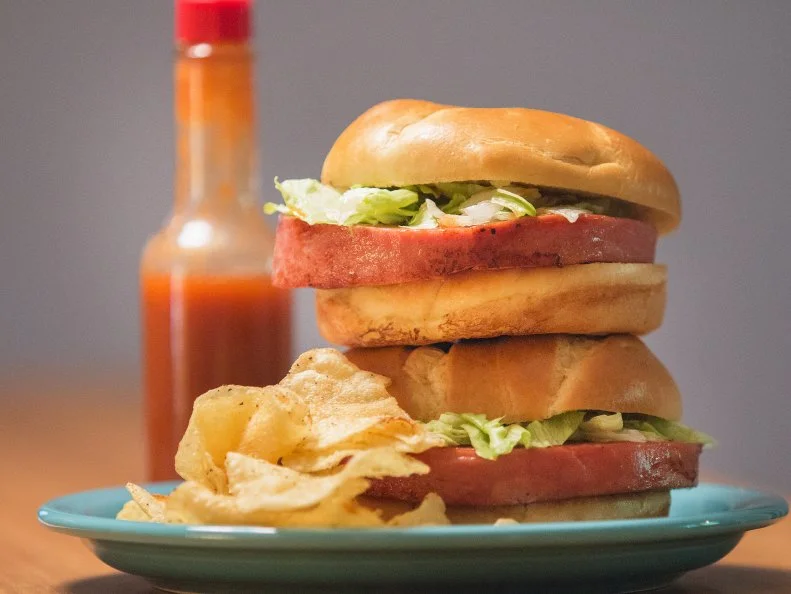 The hot bologna sandwich is a rite of passage in West Virginia, served in restaurants and made at home. Thick-cut bologna is fried, then doused with barbecue sauce and piled on bread with lettuce, cheese and a dash of hot sauce. The sandwich is serve at popular Charleston restaurants like Dem 2 Brothers and a Grill and The Smokehouse on Charleston's West Side, and Tricky Fish on the East End, where owner Keeley Steel serves it with house BOG sauce, Swiss cheese, caramelized onions, lettuce and tomato on a kaiser roll.