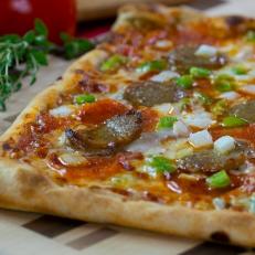 Though it might not be as well-known as Chicago or New York, Omaha has its own specific style of pizza, and you’ll find it at La Casa Pizzeria, an old-school shop with an incredible neon sign out front. The crust is rich and sort of flaky, a buttery biscuit-like concoction served in a giant rectangle and cut into squares. The most-popular topping combination is a layer of ground beef topped with onions and mushrooms. The tomato sauce is thin and bright, hidden between the crust and meat. 