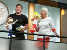 Hosts Tyler Florence and Anne Burrell play and take selfies with ballons that were made to look like them, as seen on Worst Cooks In America Season 12.