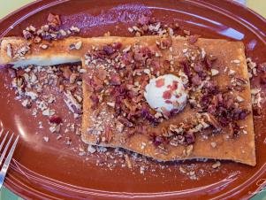 You don’t have to search the nation high and low for inventive pancake add-ins, but pancakes in playful shapes get bonus points for ingenuity. This chic, all-day breakfast hub pays homage to its home state in the form of the Famous PanOKCakes. Made with sweet cream batter and strewn with bacon, local pecans, bourbon-maple glaze and mascarpone butter, these fluffy ’cakes are cooked and then sculpted to resemble the Buckeye State. The Strawberry Dream, Blueberry Streusel and Piña Caramelo stacks also feature Hatch’s specialty sweet cream batter and luscious fruit compote. Classic buttermilk, gluten-free sweet potato and chocolate chip pancakes are among some of the more mainstream options. Can’t make up your mind? Go for the Pancake Flight — it’s any three pancakes of your choice.