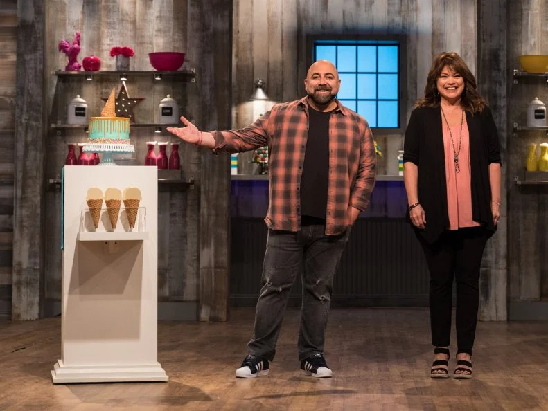 Duff Goldman and Valerie Bertinelli next to the main heat challenge, as seen on Food Network's Kids Baking Championship Season 4