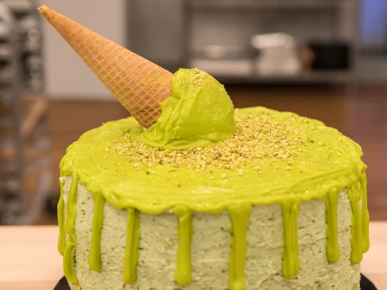 Contestant Abby Martin's completed dish from the main heat challenge, Pistachio Cake with Pistachio Buttercream, as seen on Food Network's Kids Baking Championship Season 4