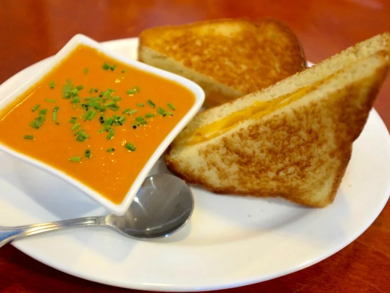 This low-key spot goes beyond basic diner fare by upping the ante on American classics. One satisfying combo that won’t sabotage your budget is the grilled cheese sandwich paired with tomato soup for $10. You won’t find skimpy slices of white bread here. Instead, Eat Americana’s kitchen builds its sandwich on thick Texas toast that’s layered with three different cheeses, then griddled until golden. As for the soup, it’s so dense that it’s more of a dip that clings to your sandwich. Nostalgia never tasted so rich (yet cost so little).