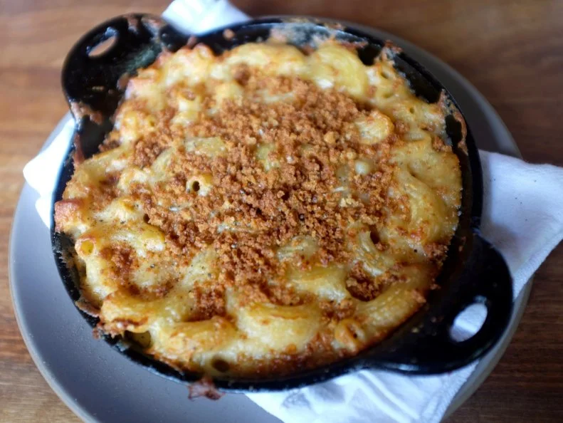 This cafe puts American cheese front and center with menu options that include cheese flights, raclette and cheese-centric sandwiches. The mac and cheese is where it’s at, though. Mission Cheese’s kitchen amps up the richness by pulling in two kinds of cheeses (clothbound cheddar and washed rind cow’s milk), then topping the pasta with a crisp layer of breadcrumbs. Served in a piping-hot miniature skillet and priced at $10.50, this mac makes for a great shareable plate, though we won’t blame you for wanting this creamy dish all for yourself. 
