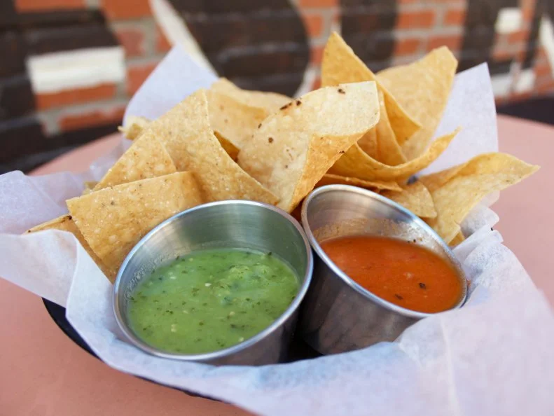 At Phoenix live music venue Crescent Ballroom, concert go-ers and touring bands alike nosh on snacks and small plates from Cocina 10, which gets its name and menu inspiration from the Sunbelt’s I-10 highway and environs. From the “Mexican-accented road food” menu, don’t overlook the chips and salsa, a local favorite. Hand cut chips, made from Sonoran-style tortillas, are served with a duo of salsas, including tomatillo, featuring a smooth blend of tomatillos, jalapenos, avocados and cilantro, and chile de arbol, a fire-roasted salsa made with Roma tomatoes, serrano chiles and garlic. The salsas are so popular that the kitchen churns out more than 2,000 gallons a year; though they’ve received multiple requests to sell it, the chefs insist that that level of freshness just can’t be bottled.