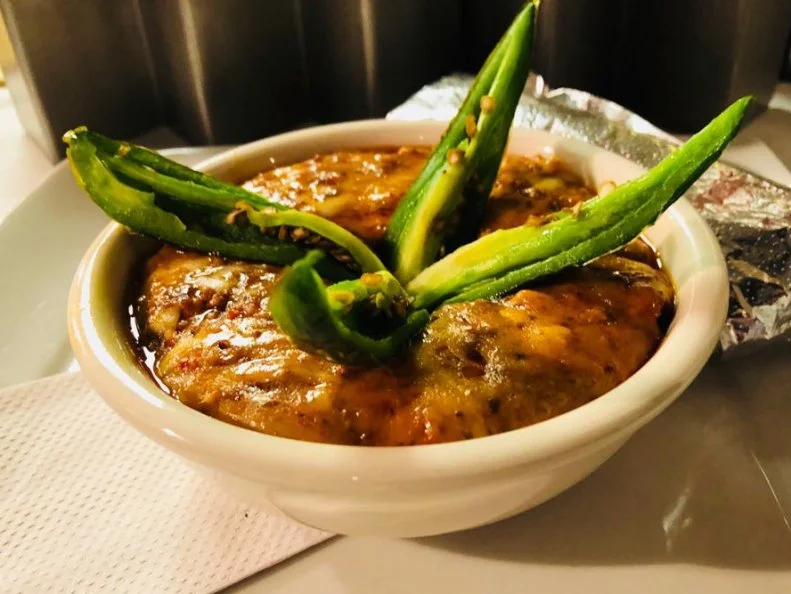 Though Colorado is in the heart of the Rockies, its culinary scene showcases a lot of below-the-border influence, owing to its dry climate and large Hispanic community. Denverâ  s Chili Verde pays tribute to traditional southern Mexican dishes and family recipes, like Chef-Owner Eder Yanez-Motaâ  s choriqueso, a chorizo-studded cheese dip. Chili Verdeâ  s version stars house-made chorizo spiced with guajillo, ancho and arbol chiles, blended with asadero, a semi-soft Mexican white cheese. The mixture is cured for two days, then cooked on the stove until nicely melted and melded. The dip is garnished with fried jalapeno peppers and served with corn tortillas. Donâ  t ask for chips â   theyâ  re not sturdy enough for scooping â   instead, coax some of the stretchy choriqueso onto a corn tortilla and eat it like a cheese taco.