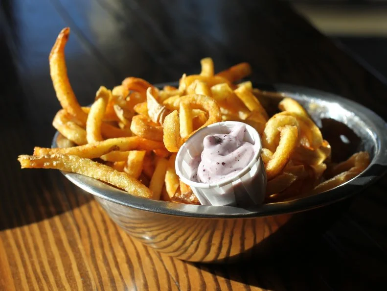 What to do with all those Idaho potatoes? Turn them into French fries! Boise Fry Company takes the state’s prized tuber as inspiration for seemingly limitless combinations. You can order from eight types of potatoes and vegetables cut in five different ways, plus 10 different salts and house-made dipping sauces. In Idaho, you can’t serve fries without fry sauce (a ketchup-mayo blend), but the dipping sauce that has given BFC a cult following is the blueberry ketchup, a creamy sauce blended with real blueberries. Choose your potato (sourced from Buhl’s M&M Heath Farms) and cutting style, say shoestring Russets or curly Yukon golds, and dip them into a side of the rich, tangy sauce to see what all the fuss is about.