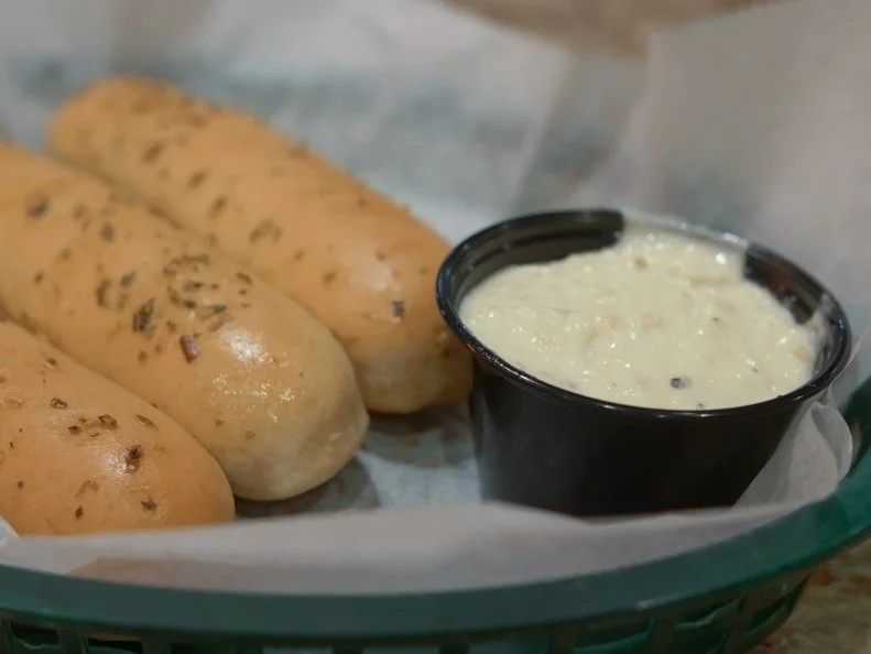 No one can definitively say why Indiana is called the Hoosier State, but cities like Indianapolis are helping to shape its reputation as a foodie state. Jockamo Upper Crust Pizza’s namesake from-scratch pizzas rack up local accolades, but their house-made dressings and sauces deserve equal billing. The Creamy Parmesan, which has gained its own cult following, was the result of a happy accident when owner Mick McGrath tried to create a Parmesan-black peppercorn salad dressing that ended up being too thick to top lettuce. Instead of scrapping it altogether, the team decided to serve it as a dip for the house bread sticks. Made with freshly grated Parmesan, lemon juice, mayonnaise and a secret blend of spices, the dip is now so popular that the restaurant’s three locations go through around 50 gallons a week. Order extra to dunk pizza crusts into, or opt for the shrimp scampi pie, which uses the warmed sauce in lieu of marinara.