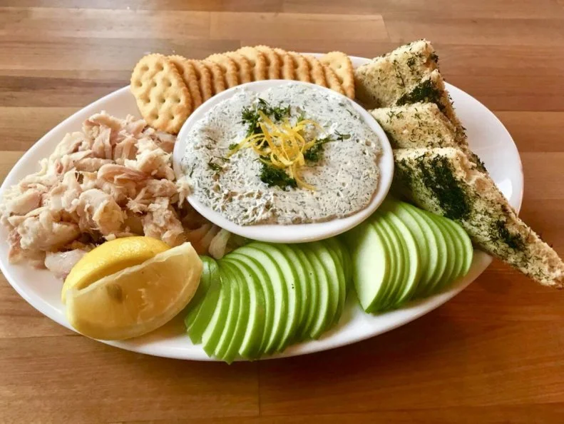 As one of the largest freshwater lakes, Lake Superior is the perfect habitat for whitefish, a cold-water fish that has traditionally been smoked to provide a food source for locals through long Michigan winters. The Vierling, overlooking Marquetteâ  s Lower Harbor on Lake Superior, is an ideal perch from which to sample the celebrated fish. The restaurant sources whole smoked whitefish â   to the tune of 40 pounds a week in summer months â   from nearby Thilâ  s Fish House. Smoked whitefish dip is a popular appetizer; here, the restaurant serves the flaked fish alongside a spread of house made cream cheese, lemon, onion, dill and capers. Combine the two components into a DIY dip, then customize your bite with the accompanying dill toast and crisp apple slices. Itâ  s a popular shareable appetizer, but also makes an ideal light lunch if you want it all to yourself.