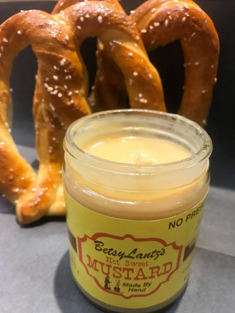 With Pennsylvania Dutch roots, soft pretzels are as much a thing in the Quaker State as the Philly cheesesteak. At Miller’s Twist, in Philadelphia’s Reading Terminal Market, the soft pretzel dough is also used in roll ups, filled with everything from bacon and eggs to the city’s namesake sandwich. But simplicity reigns supreme: The most-popular order is the “regular” soft pretzel, lightly coated with butter and salt and served hot with a side of dipping mustard. The choice mustard is the sweet-with-a-kick Betsy Lantz Hot and Sweet, which comes from owner Roger Miller’s dad’s line of mustards. The mustards are made from scratch from a generations-old secret recipe in Amish country’s Lancaster County.