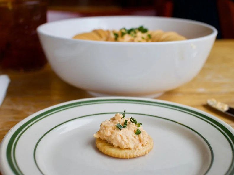 Pimento is a Southern favorite for pretty much any occasion. Richmond restaurant Comfort offers an upscale take that’s ideal for most occasions. Chef Jason Alley is a staunch believer in Duke’s mayonnaise, which he mixes with medium sharp cheddar cheese, house-roasted peppers, grated red onion, tarragon and a couple of dashes of Worcestershire and hot sauces. He knows he’s achieved the ideal creamy texture when he can drag a Ritz through it without the cracker’s shattering. To satisfy demand, Comfort, and its sister restaurant Pasture, go through 80 pounds of cheese, 14 gallons of mayonnaise and 27 pounds of roasted red peppers every week.