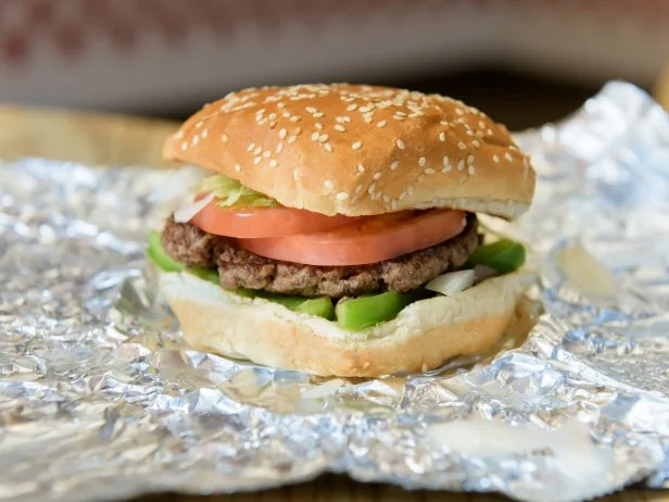 At Five Guys get the “little” burger, which has a single patty and gives you plenty of protein (16 grams). Load it up with the veggie fixin’s: grilled mushrooms and onions, green peppers, lettuce and tomato. Or you can go totally veggie with the Veggie Sandwich by swapping the burger for a slice of cheese and getting some extra protein via the free peanuts at the counter. Also a side note: The little fries aren’t exactly little in the calorie department, delivering 526 calories in a not-so-little 8-ounce portion.
