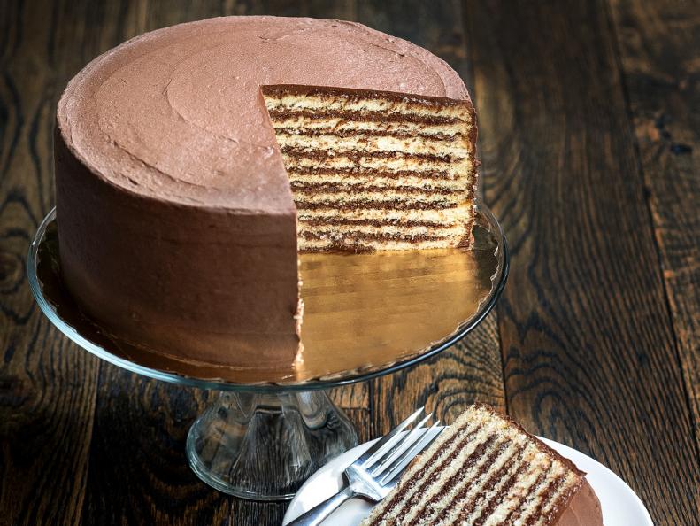 In 2008, Maryland designated the Smith Island Cake as the stateâ  s official dessert, paying homage to a treat that originated in a Chesapeake Bay fishing village more than 200 years ago. As oyster harvesters headed out to sea, families would send them off with sizable eight-layer cakes, eventually swapping out buttercream for longer-lasting chocolate fudge.